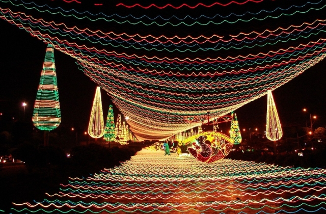 A beautiful holiday display lights up the river in Medellin.
