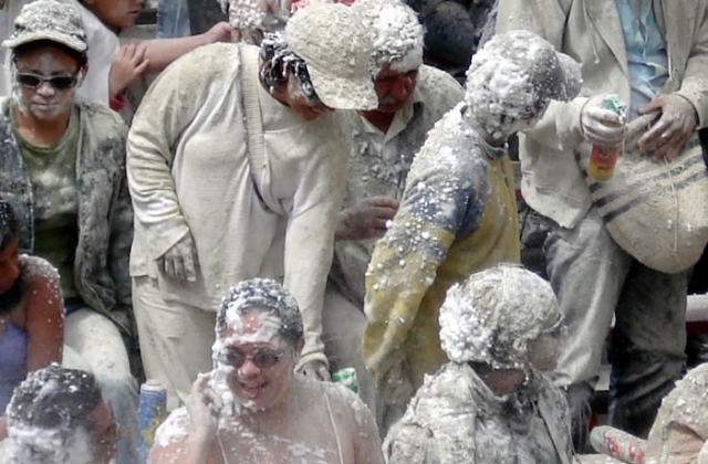 Attendees enjoy getting sprayed with foam during the day of the whites.