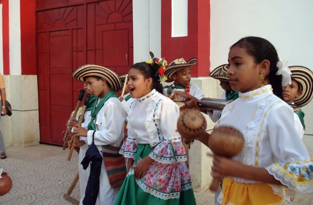 Children playing cumbia music at the street festival
