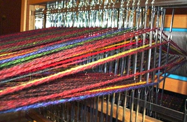 Looms, like this one, help artisans create their works of art