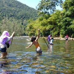 Crossing a shallow river in Dumangueña